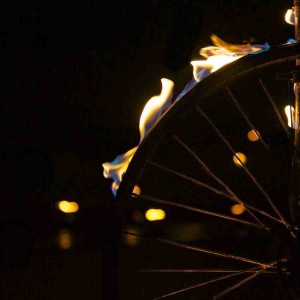 Close up of a bike wheel, with the tyre aflame