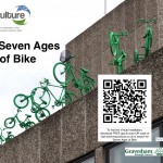 Seven green bikes - from child's bike with stabilisers, to adult's trike - leap from a rooftop. QR code links to www.recyculture.co.uk Search for 'Seven Ages...'